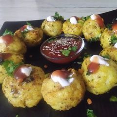 Stuffed veggies sooji (semolina) balls A picture of Stuffed veggies sooji (semolina) balls.