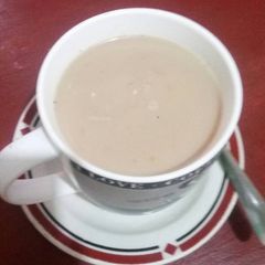 A picture of White coffee with Masala.