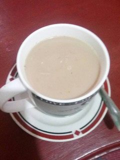 A picture of White coffee with Masala.