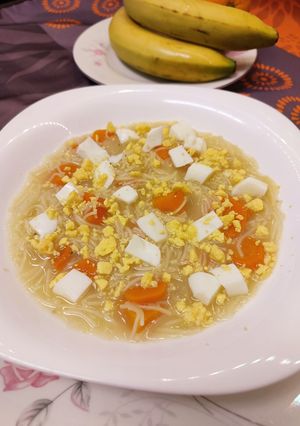 A picture of Chicken Noodle Soup with Carrot, Onion, and Hard-Boiled Egg.