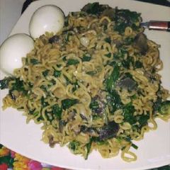 A picture of Indomine and egg with vegetable.
