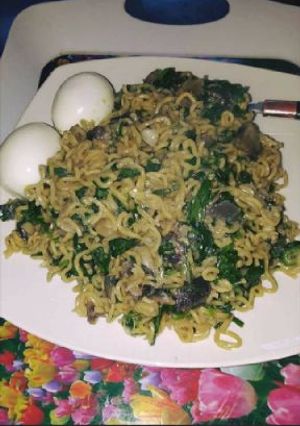A picture of Indomine and egg with vegetable.