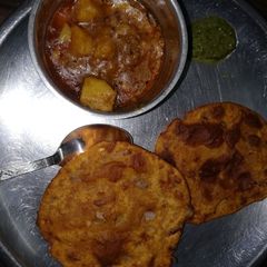 A picture of Aloo sabji with aloo onion kachori.