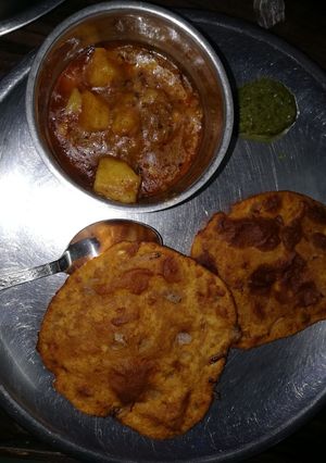 A picture of Aloo sabji with aloo onion kachori.