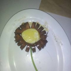 A picture of Fried sausage with an egg.
