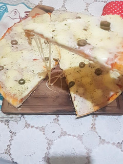 Una foto de Pizza Casera de Muzzarella