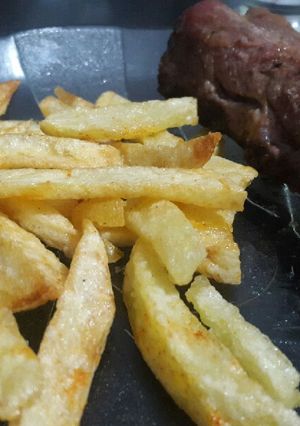 Una foto de Costillas de cerdo con papas fritas