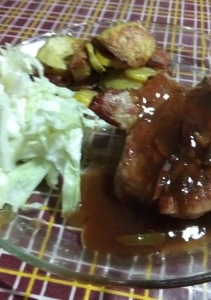 Una foto de Bondiola de cerdo con salsa de Naranja