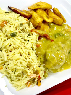 A picture of Basmatic rice with curry sauce and fried plantain.