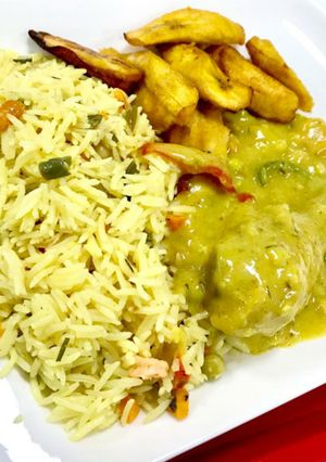 A picture of Basmatic rice with curry sauce and fried plantain.
