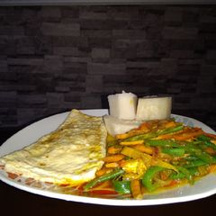 A picture of Boiled yam, Omelette and vegetable gravy.