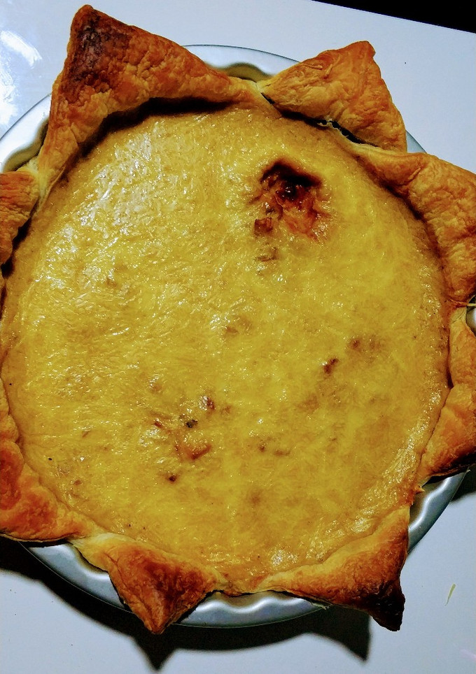 Una foto de Quiche de cebolla, bacon y cabrales