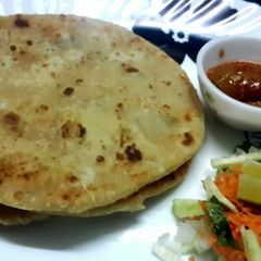 A picture of Aloo Paratha /Potato stuffed Indian flat bread.
