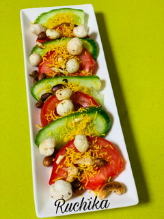 A picture of Tomato Cucumber and nuts salad.