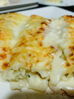 Una foto de Canelones de merluza y gambas