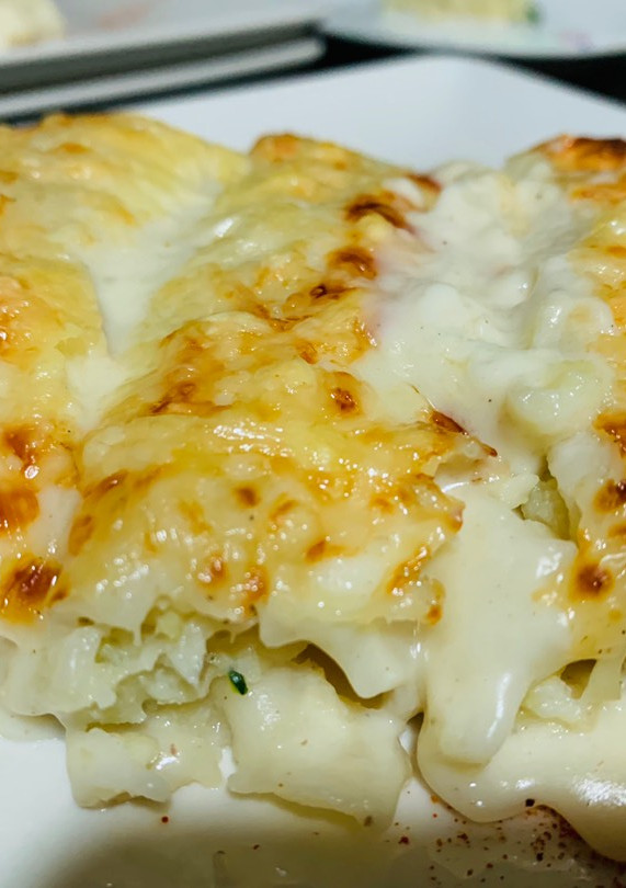 Una foto de Canelones de merluza y gambas