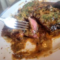 A picture of T-Bone Steak on Toast w/Creamed Drip Sauce & Red Pepper +Parsley.