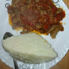 A picture of Carbonate of beef and ugali.