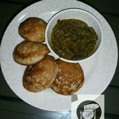 A picture of Cocount masa with groundnut soup.