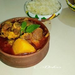 A picture of Bengali Style Mutton Curry with potatoes.