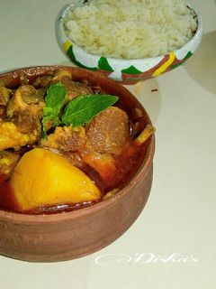 A picture of Bengali Style Mutton Curry with potatoes.
