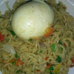 A picture of Noodles with boiled egg.