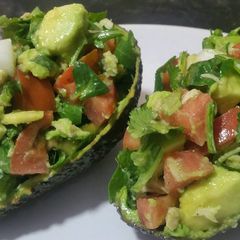A picture of Avocado salad in an avocado!.