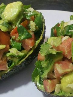 A picture of Avocado salad in an avocado!.
