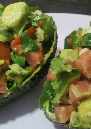 A picture of Avocado salad in an avocado!.