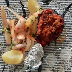 A picture of Tandoori chicken drumstick.