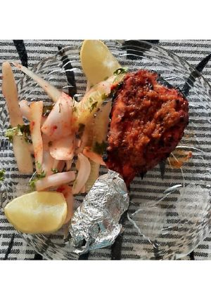 A picture of Tandoori chicken drumstick.
