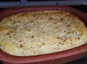 Una foto de horno de leña verduras