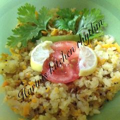 A picture of Poha Upma with carrot.