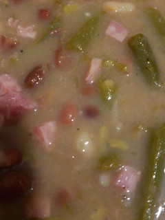 A picture of Ham and beans with greenbeans.