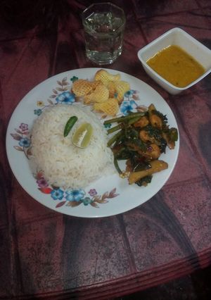 A picture of Kumro shaak with chingri mach and dal a tasty lunch.