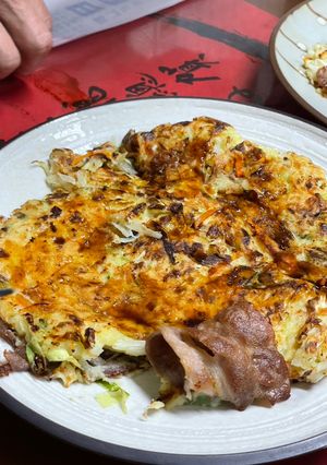A picture of Okonomiyaki with Sauce.