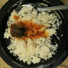 A picture of White rice and catfish stew.