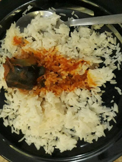 A picture of White rice and catfish stew.