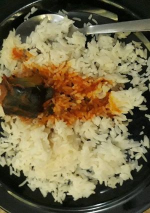 A picture of White rice and catfish stew.