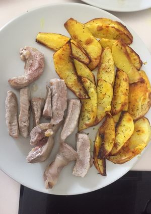 Una foto de Patatas en gajos al horno con secreto