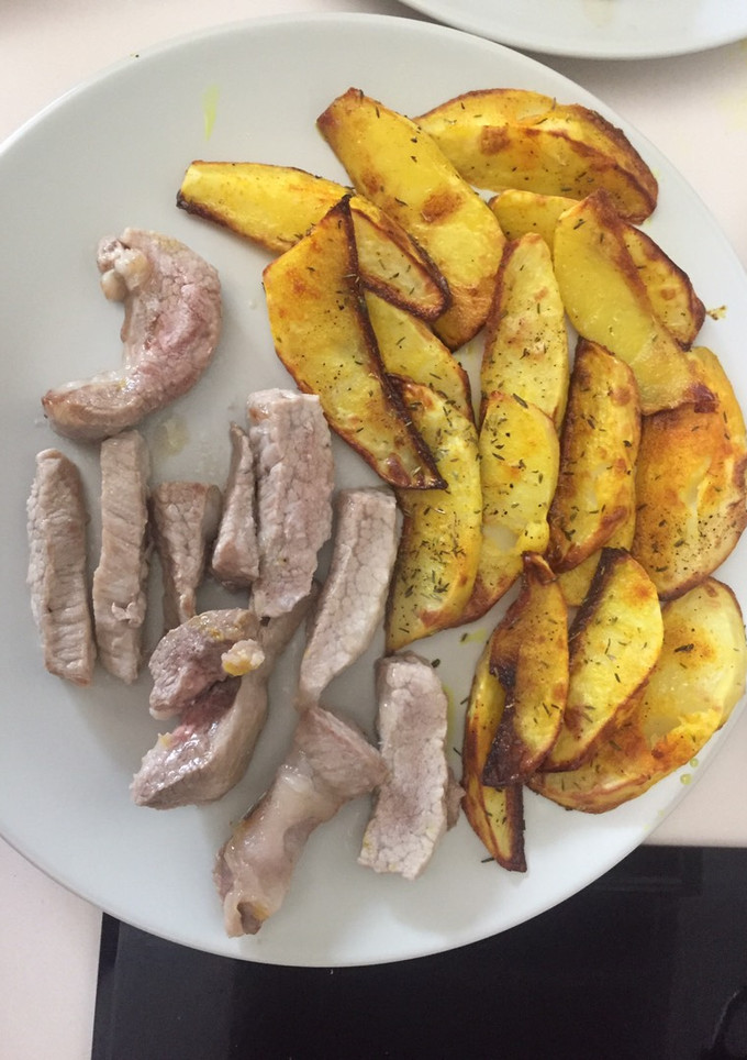 Una foto de Patatas en gajos al horno con secreto