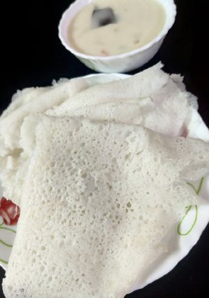 A picture of Neer Dosa with Veg Stew.