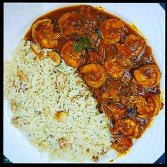 A picture of Coconut Shrimp curry with rice.