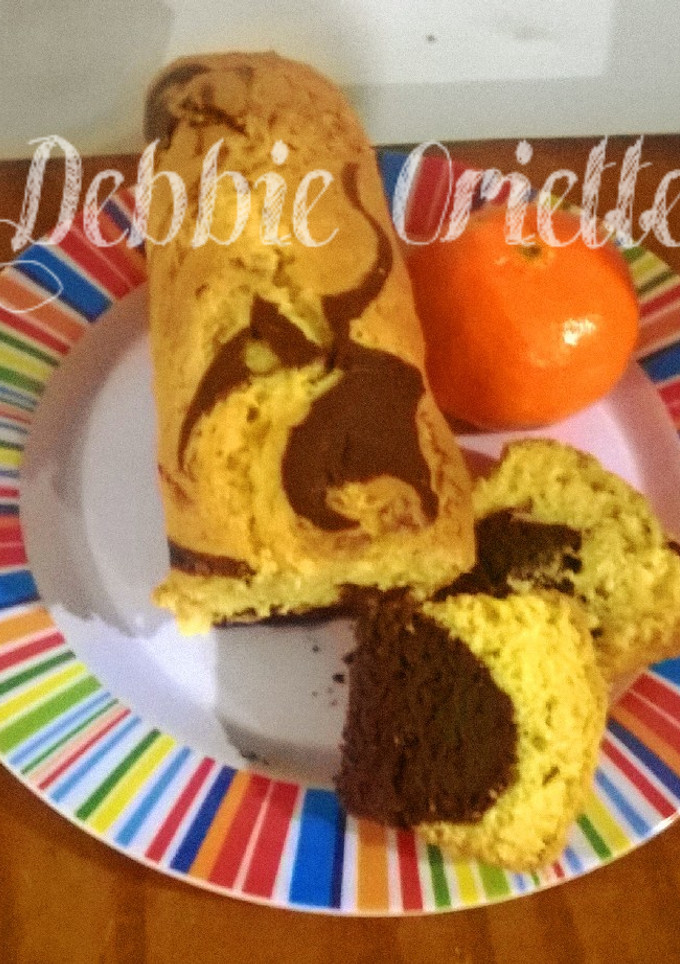 Una foto de Budín de Mandarina 🍊 Marmolado (Mi versión) súper Económicos)