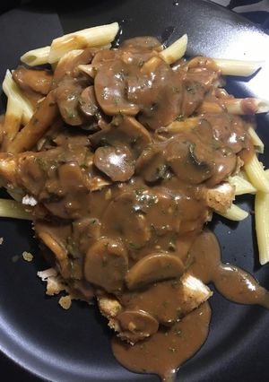 A picture of Chicken fried chicken w/ roasted garlic mushroom gravy.
