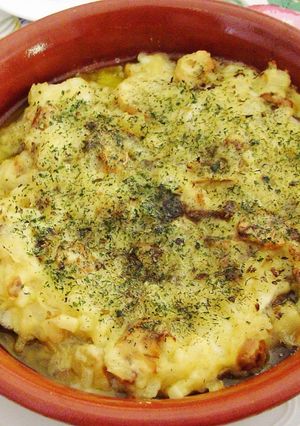 Una foto de Merluza en salsa verde y champiñones al horno