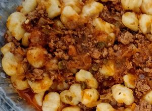 Una foto de Ñoquis con tuco de carne