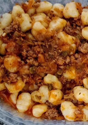 Una foto de Ñoquis con tuco de carne