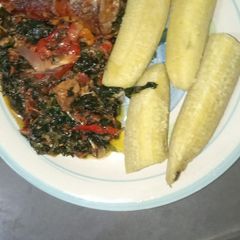 A picture of Unripe plantain with Vegetables sauce.