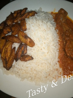 A picture of White Rice and Chicken Stew.
